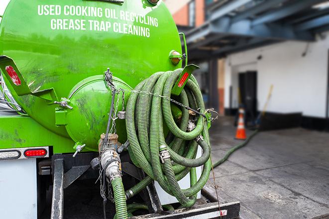 pumping out a heavy-duty grease trap at a restaurant in Topsfield